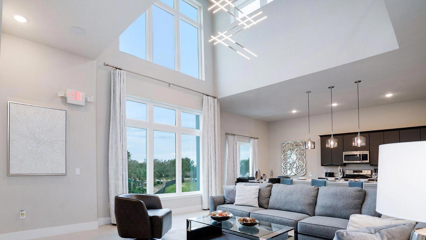 Spacious great room with floor-to-ceiling windows.