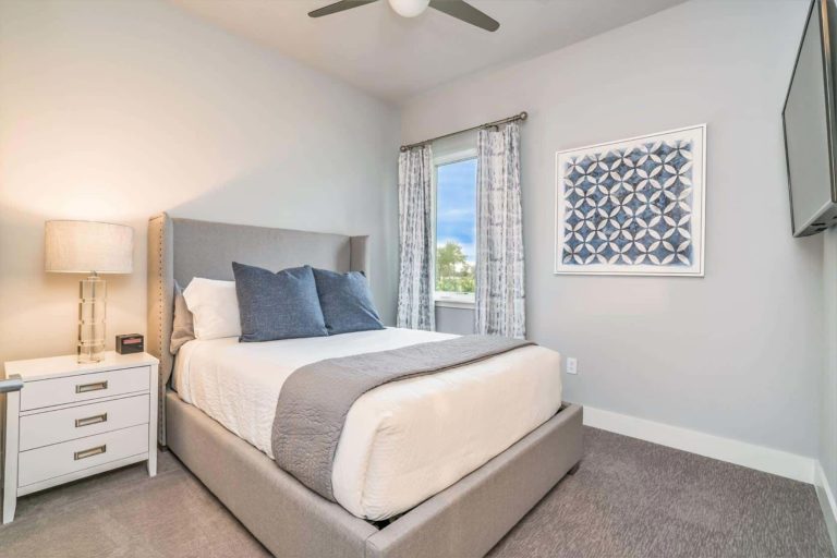 Furnished Bedroom Inside A Spectrum Resort Orlando Residence.
