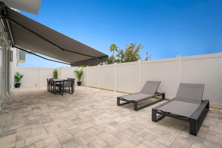 Outdoor Patio With Lounge Chairs At A Spectrum Resort Orlando Residence.