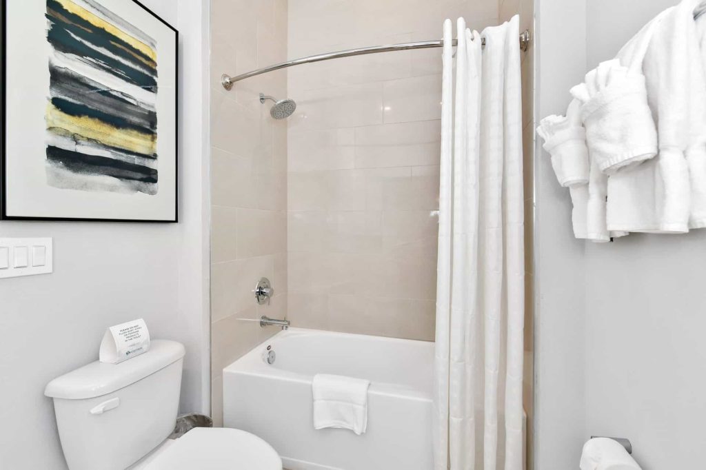 Bathroom 2 with toilet and combination shower and bathtub: 4 Bedroom Condo