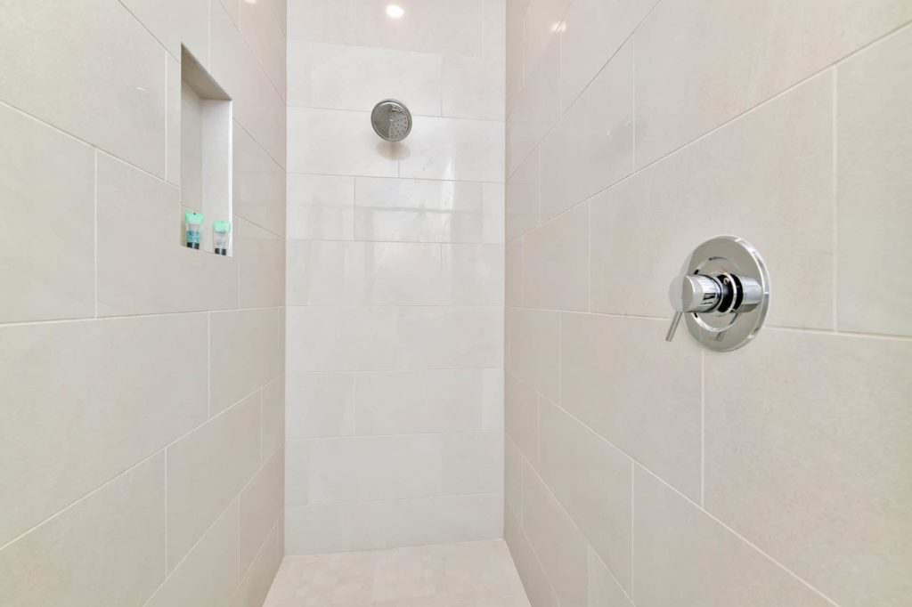 Walk-in shower with shelf for bathroom amenities: 4 Bedroom Condo