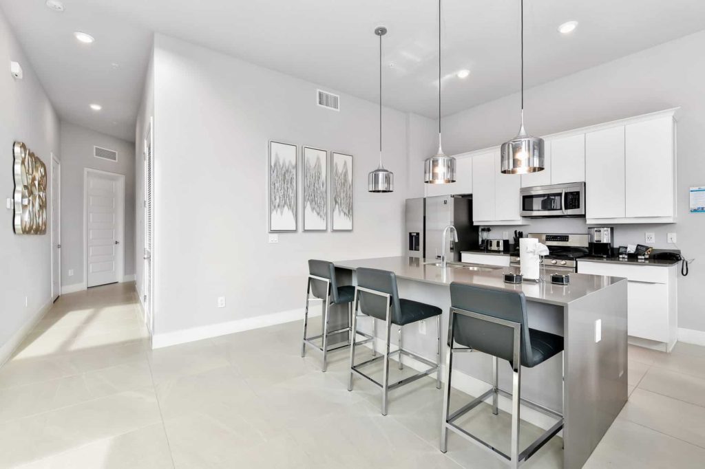 Full kitchen with island barstool seating: 4 Bedroom Condo