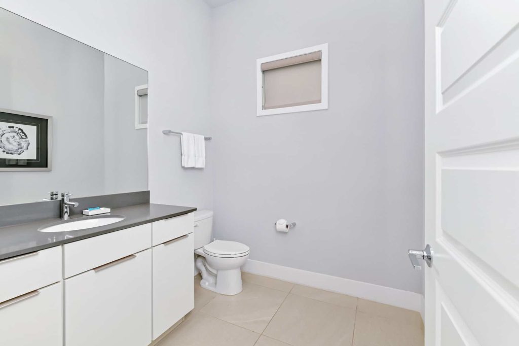Half-bathroom with sink and toilet: 5 Bedroom Condo