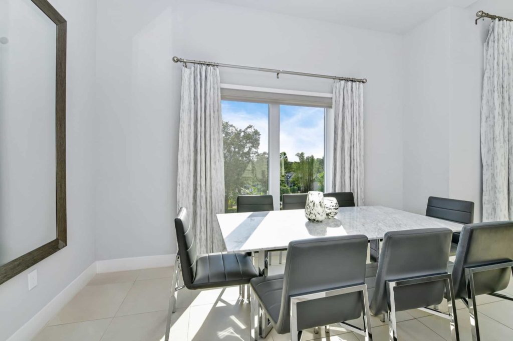 Dining room with table for 8 and large windows: 5 Bedroom Condo