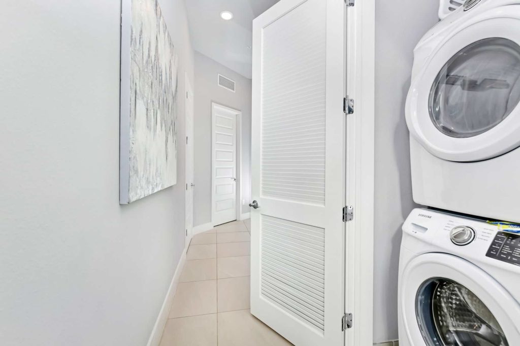 Laundry room with stacked washer and dryer: 5 Bedroom Condo