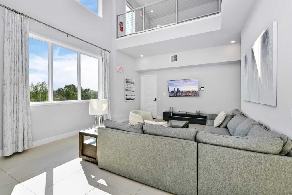 Floor-to-ceiling windows in living room and overhead loft: 5 Bedroom Condo