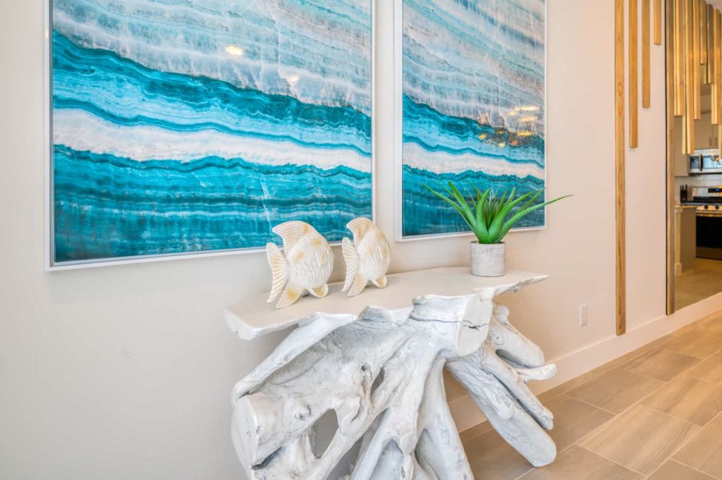 Living room end table with tropical ocean-inspired decor: 3 Bedroom Townhome