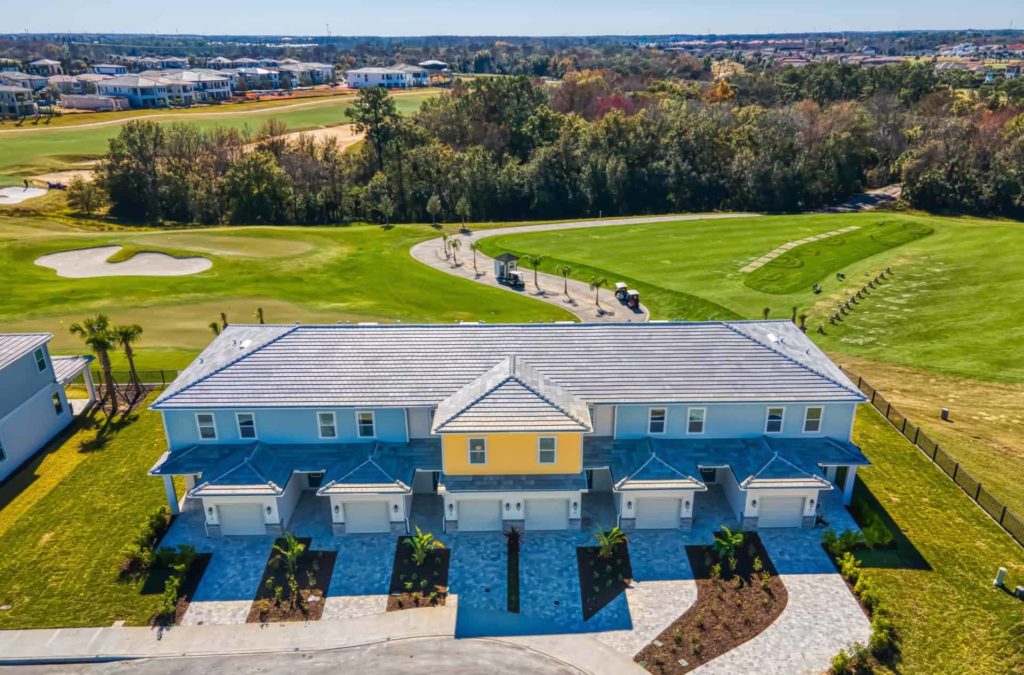 3 Bedroom Townhome exterior front aerial view with golf course in background