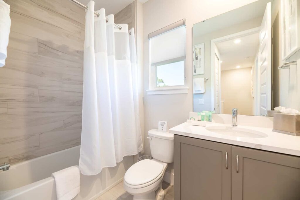 Full bathroom with sink, toilet, and combination bathtub and shower