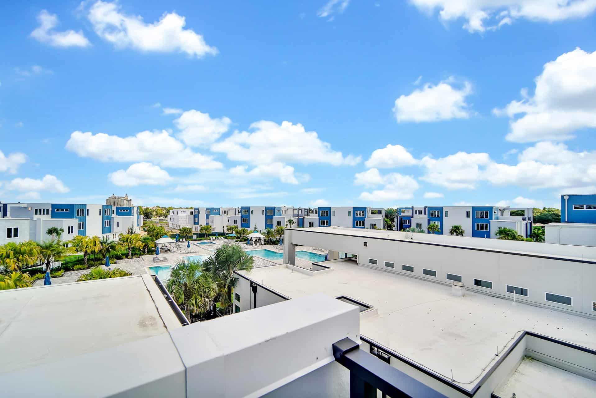 View of Spectrum Resort Orlando clubhouse pool from upper-floor sun terrace