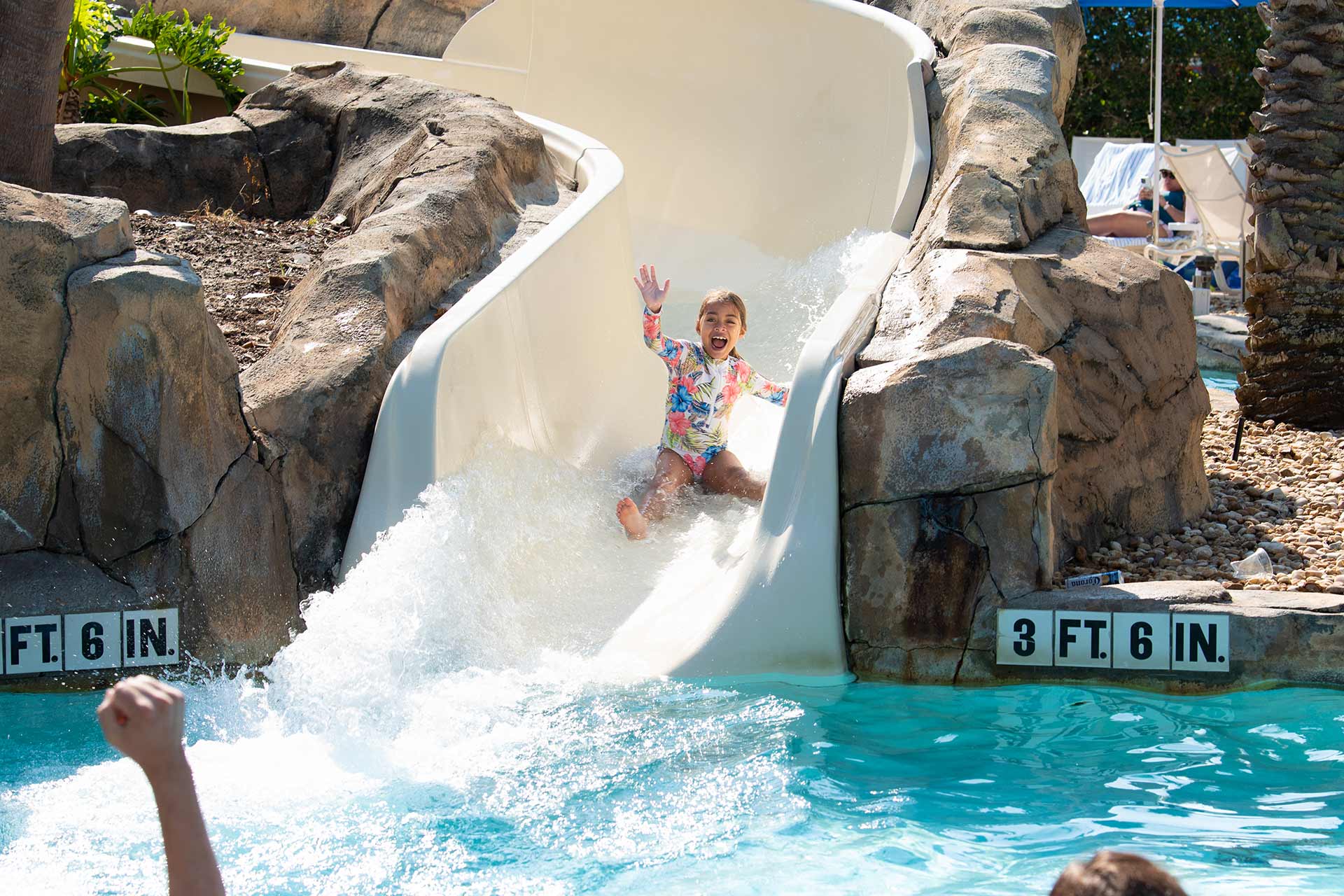 Young girl going down the water slide at the Water Park at Reunion Resort