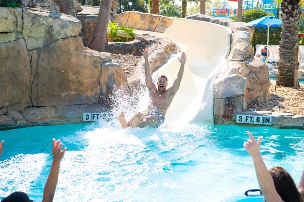 Man going down the water slide at the Reunion Resort Water Park