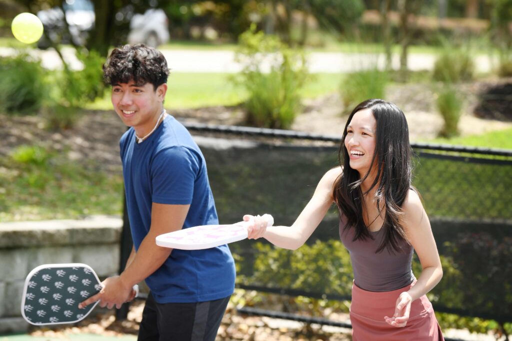 Couple playing pickleball at Reunion Resort