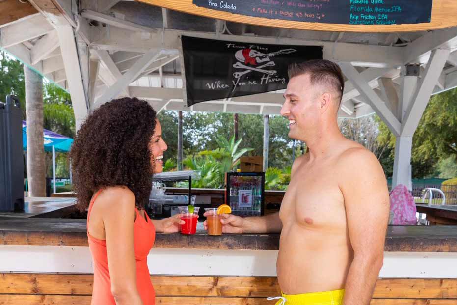 Couple drinking mixed cocktails at Drifters Bar at the Reunion Resort Water Park