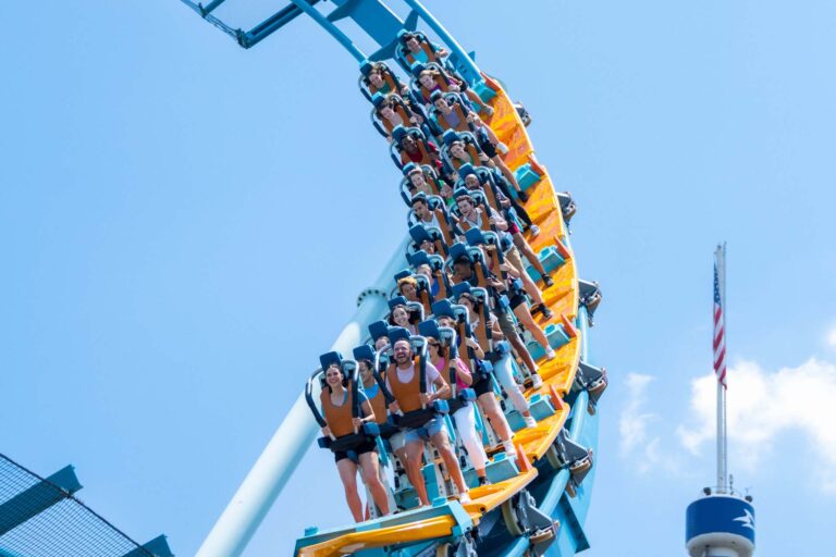 People riding the Pipeline standing roller coaster at SeaWorld Orlando