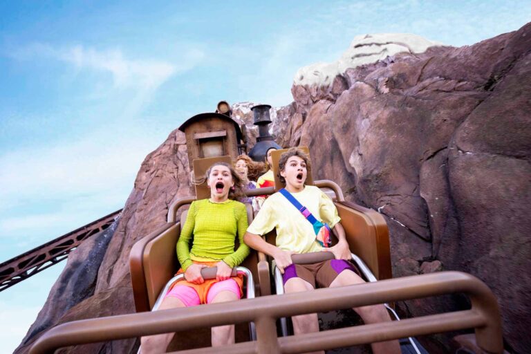 Friends riding on Expedition Everest roller coaster at Disney's Animal Kingdom