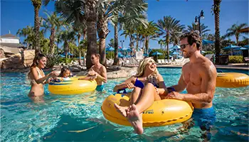 Amenities: Families in the water park lazy river