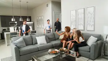 Condo Offers: Group relaxing and taking pictures together in a resort condo