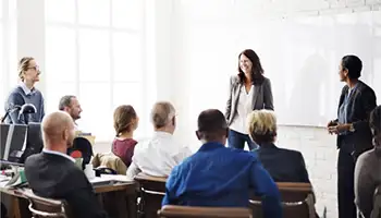 Corporate Events: Woman presenting at a corporate event
