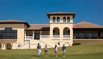 Golf Group Request Form: Group of couples playing a round of golf next to the Jack Nicklaus Clubhouse at Reunion Resort