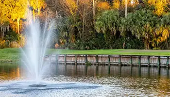 Partner Golf Destinations: Golf course water hazard with fountain